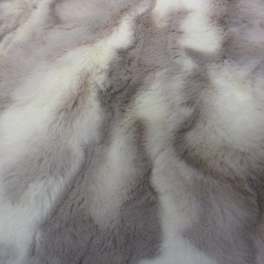 Close-up of a gray and white fur-like fabric texture