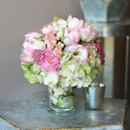 Pink and white bouquet in a clear glass vase