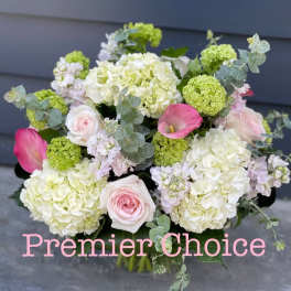 Bouquet of pale hydrangeas, pink roses, and pink calla lilies