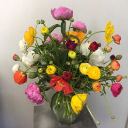Colorful mixed bouquet in a clear glass vase