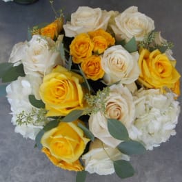 Bouquet of white and yellow roses with white hydrangeas