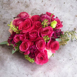 Hot pink rose bouquet with small accent flowers