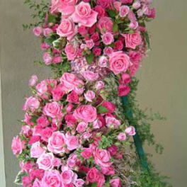 Tall pink rose standing spray on a green easel