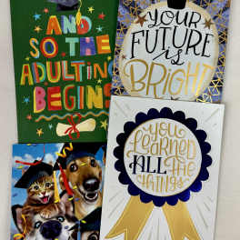 Four graduation-themed greeting cards with caps, ribbons, and celebratory text