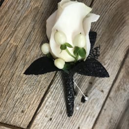 White rose boutonniere with black ribbon and pearl pins
