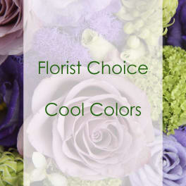 Cool-toned floral arrangement with white roses and purple blooms