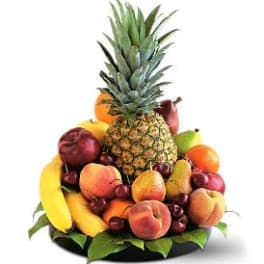 Fruit arrangement with pineapple, bananas, peaches, pears, grapes, and apples