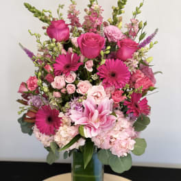 Pink mixed bouquet in a clear glass vase