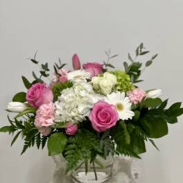 Pink and white mixed bouquet in a clear glass vase