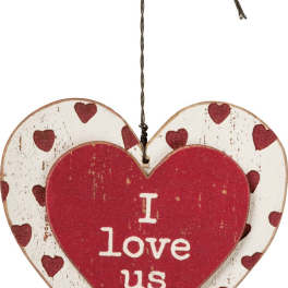 Heart-shaped hanging sign with red hearts and the words I love us