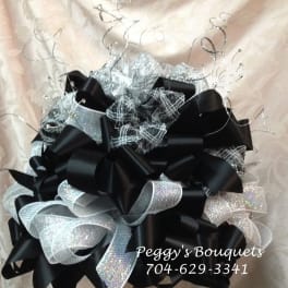 Black and silver decorative ribbon bouquet with curly wire accents
