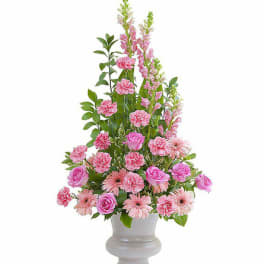 Pink flowers arranged in a tall gray vase