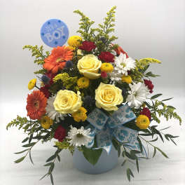 Mixed bouquet in a blue vase with an "It's a Boy" balloon and ribbon