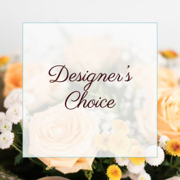Designer’s Choice floral arrangement with peach roses and white daisies