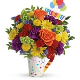 Colorful bouquet in a decorated cup with balloons and a birthday sign