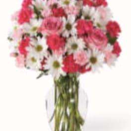 Pink and white mixed bouquet in a clear glass vase