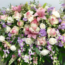 Large bouquet of pink and white roses with purple flowers