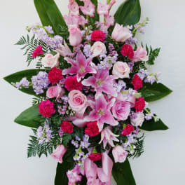 Pink and lavender floral standing spray with lilies and roses