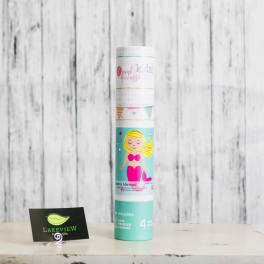 A rolled kids mermaid canvas kit stands on a table.