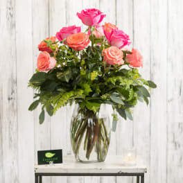 Pink and peach roses in a clear glass vase