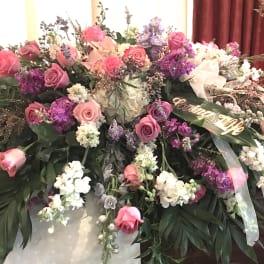 Large floral spray with pink and purple roses and white blooms