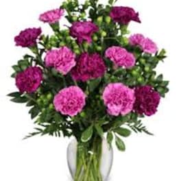 Pink carnations in a clear glass vase