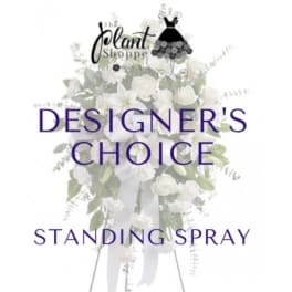 White standing spray with ribbon and dress-shaped logo overlay