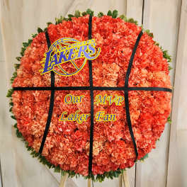 Round orange carnation tribute with a Los Angeles Lakers sign