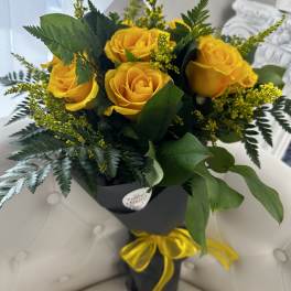 Dozen Yellow Roses wrapped bouquet by Westford Florist Art by Veny