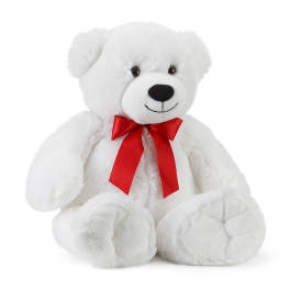 White teddy bear with a red ribbon bow