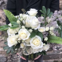 Bouquet of white roses with greenery and lavender filler