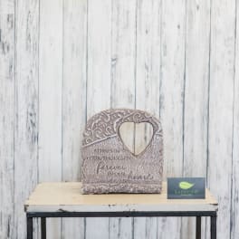 Heart-shaped memorial stone with an engraved sympathy message