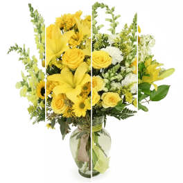 Yellow mixed flower bouquet in a glass vase
