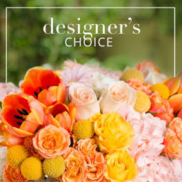 Bright mixed bouquet of orange, yellow, pink, and white flowers