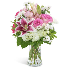Pink and white mixed bouquet in a clear glass vase
