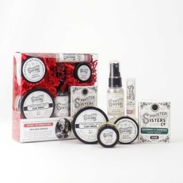 Skincare gift set with jars, tubes, and a spray bottle in a box