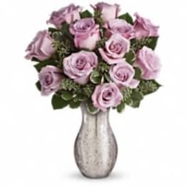Bouquet of lavender roses in a silver vase