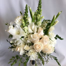 White and cream floral arrangement in a silver vase