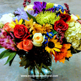 Colorful mixed bouquet in a clear glass vase