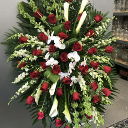 Large standing floral spray with red roses, white calla lilies, and white orchids