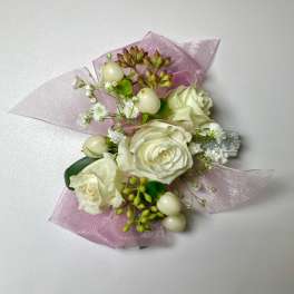 White rose corsage with pink tulle and pearl accents