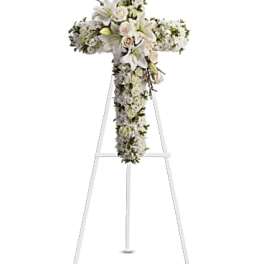 White floral cross on a standing easel