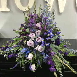 Large purple and blue floral spray with roses and iris