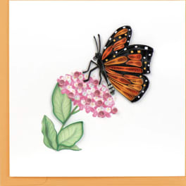 Greeting card with orange quilled butterfly on pink flowers and an orange border