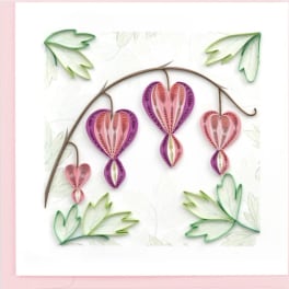 Paper quilled hearts hanging from a curved branch on a white background