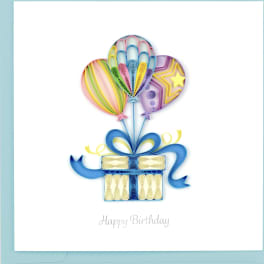 Birthday card with quilled balloons rising from a gift box