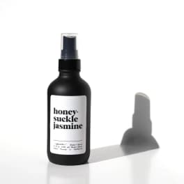 Black honeysuckle jasmine room spray bottle with white label on white background