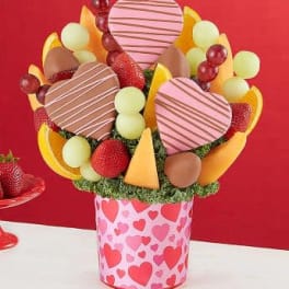 Heart-shaped fruit bouquet in a pink heart-patterned container
