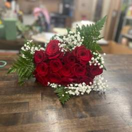 Red rose bouquet with baby's breath and fern greenery