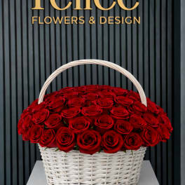 Basket of red roses with a white handle